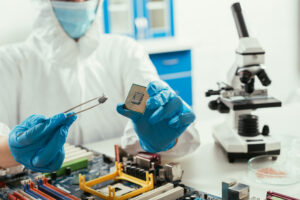 Picture of a man in overalls wearing a microchip