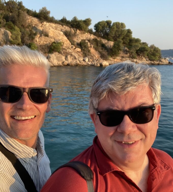 Paul Angell and Guy Clapperton against a Greek Island backdrop